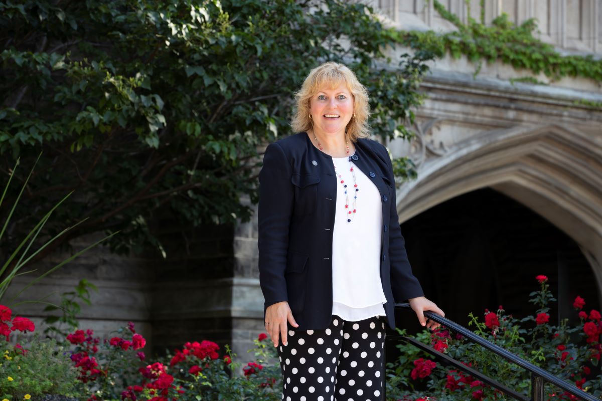 Provost Susan Tighe in front of University Hall